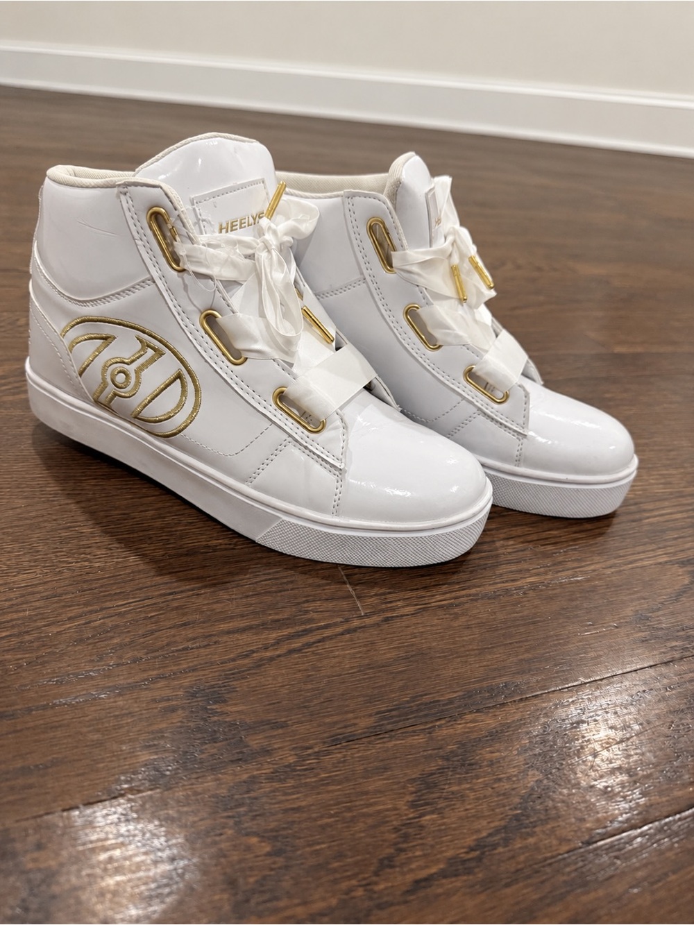 Heelys White High-Top Sneakers with Gold Accents
